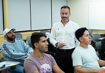 Jhon Cardona teaching students in an ESL class