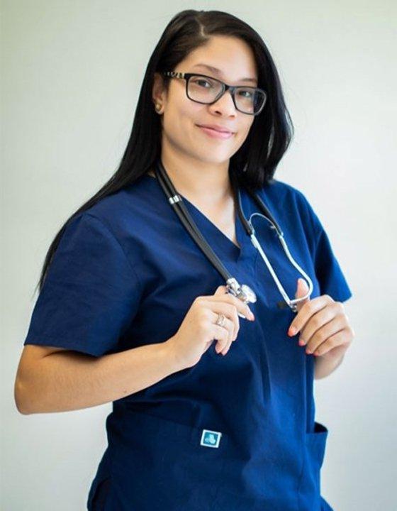 Nursing student in scrubs with stethoscope