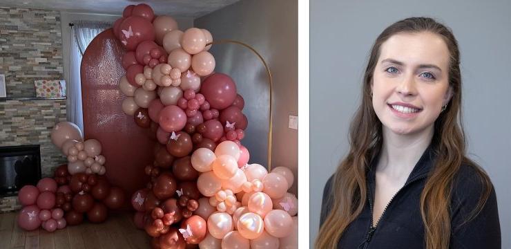 Samantha poses beside an image of balloons from floor to ceiling